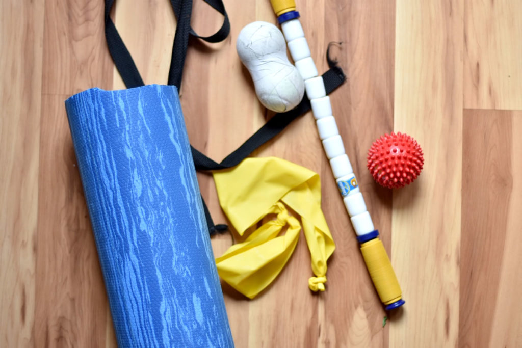 Recovery Kit including foam roller, strap, lacrosse balls stretchy bands and stick. [Photo] Erika Flowers